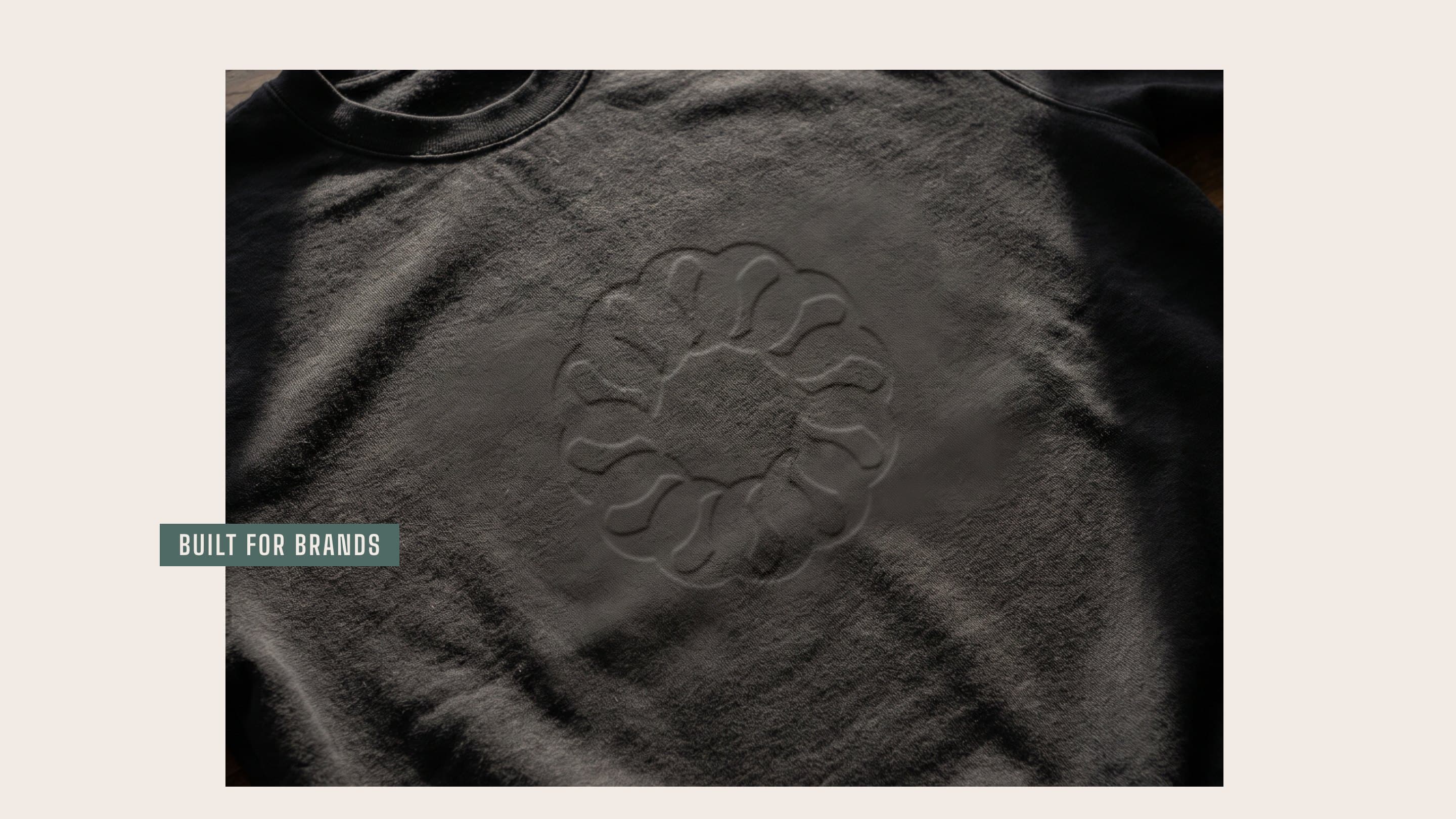 The Barekind loop debossed tone on tone into an onyx fleece, a Built for brands tab across