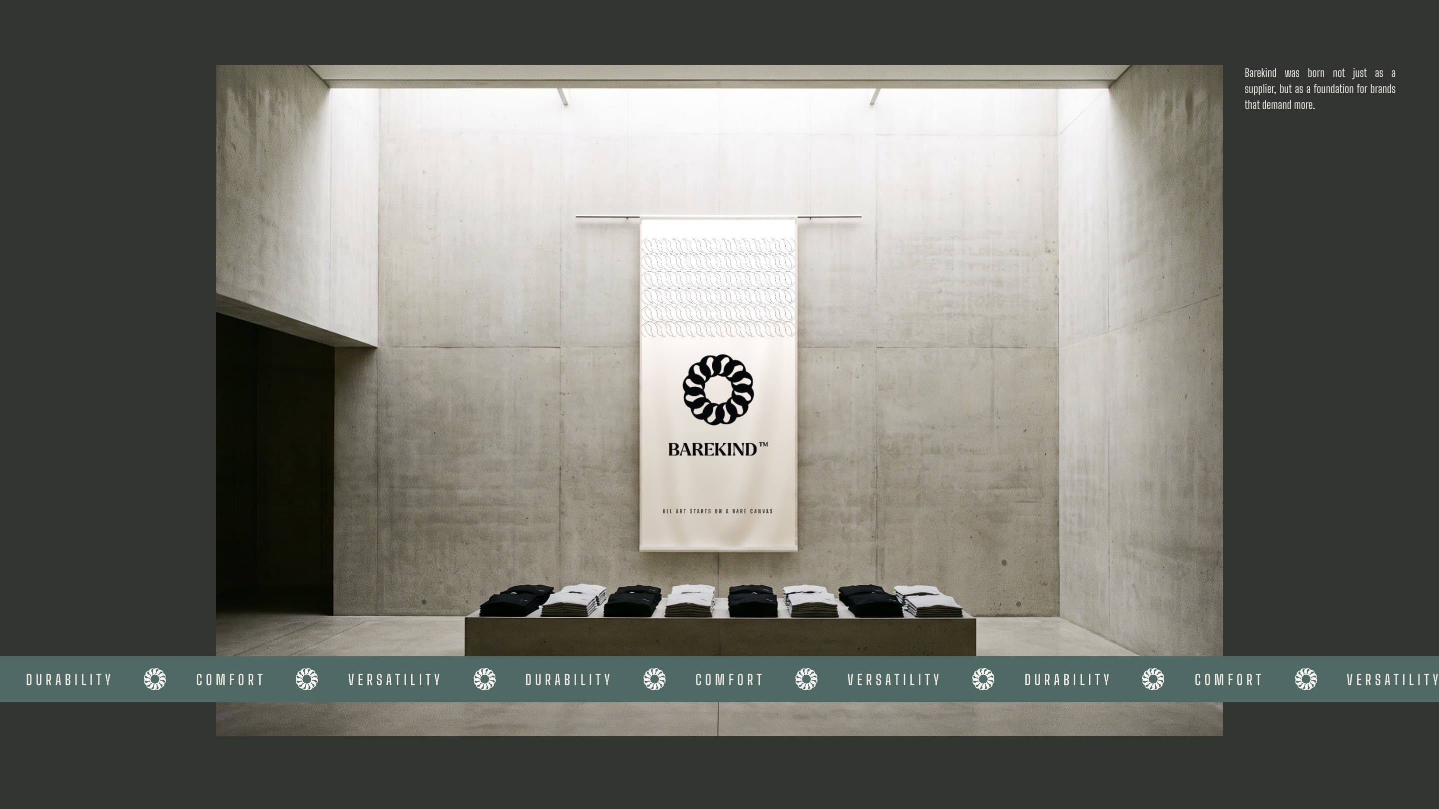 A Barekind banner hung in a concrete gallery above stacks of blanks, the band of Durability, Comfort and Versatility across it
