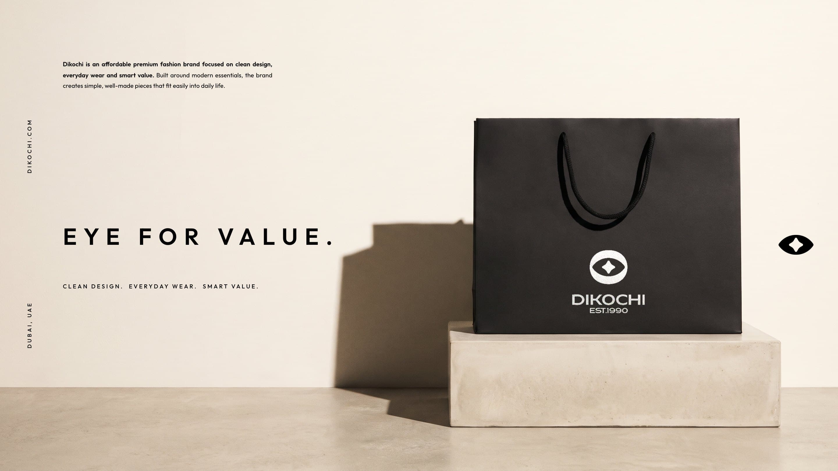 The black Dikochi bag on a stone plinth in low sun: Eye for value.
