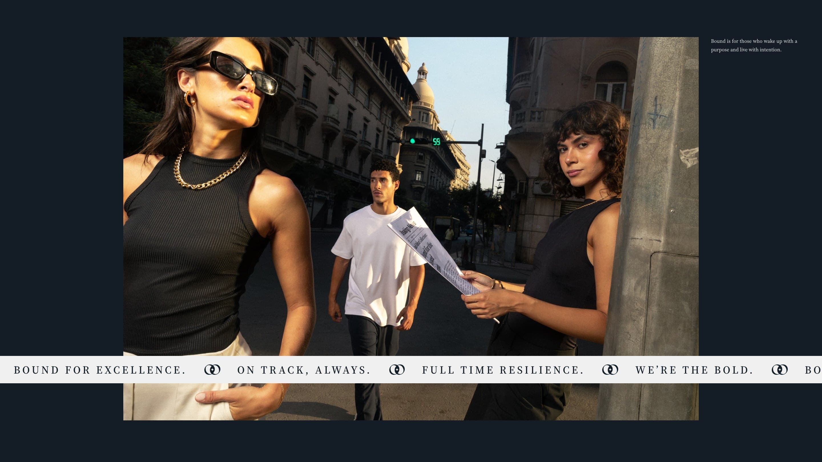 The Bound group shoot on a downtown street, with the line band across it